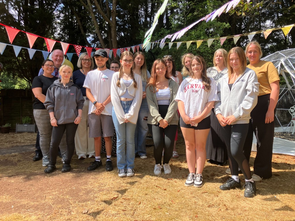 A group of people stood in a garden