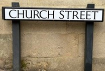 White street sign that reads Church Street White street sign that reads Church Street