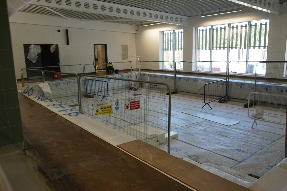 An empty swimming pool under construction