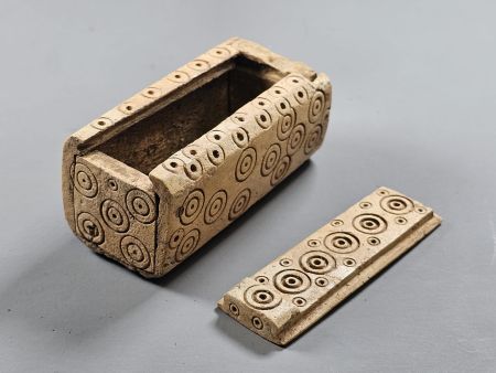 Roman bone box with the lid removed.