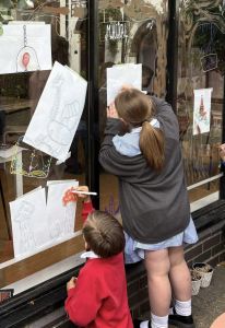 Young people creating artwork on the trail